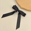 Detailed view of the black satin double-layered bow hair clip with elegant long streamers - Spring Clips / Black