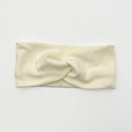 Diadema de punto elástico con diseño de nudo en color beige para un peinado cómodo - Beige