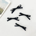 Vierer-Set minimalistische schwarze Ripsband-Haarspangen auf weißem Hintergrund - Schwarz
