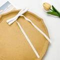 Detail of elegant white velvet bow hair clip with long ribbons on a decorative stone tray - White