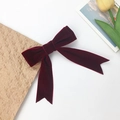 Elegant deep red velvet double-layered bow hair clip with long streamers on white surface - Burgundy