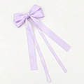 Detail of light purple satin bow hair clip with long ribbons on a plain white surface - Purple