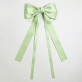 Detail of light green satin bow hair clip with flowing ribbons and glossy finish - Light Green