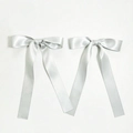 Detail of two silver satin bow hair clips with long ribbons and smooth glossy texture - Silver Gray