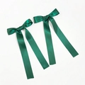 Detail of dark green satin bow hair clips with long ribbons in silky fabric texture - Dark Green