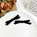 Pair of elegant black velvet bow hair clips for women in a vintage French style setting - Black