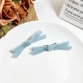 Detail of light blue velvet bow hair clips with white trim and silver duckbill clips - Light Blue