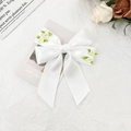 Detail of white satin bow hair clip with cream roses and leaves in French rural style - White