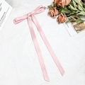 Elegant light pink satin bow hair clip with long ribbons on a decorative background - Pink