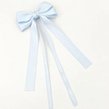 Close-up of the light blue satin bow hair clip featuring elegant long hanging ribbons - Blue