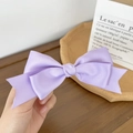 Detail of a purple satin double-layered bow hair clip with elegant glossy texture - Light Purple