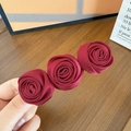 Detail of three handmade dark red satin fabric roses on a vintage style hair clip - Wine Red Satin (1#)