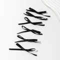 Set of six elegant black satin bow hair clips with long ribbons in a minimalist arrangement - Black
