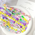 Close-up of colorful handmade resin beaded phone straps with fruits and smileys - Mixed Color Styles (P1)