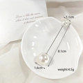 Detailed view of elegant double pearl brooch pins on white shell plate background - 8.1cm Silver Stick Pearl Brooch