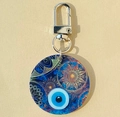 Detail of bohemian acrylic evil eye keychain with blue mandala pattern and lobster clasp - Blue Round Floral Evil Eye Keychain