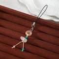 Macro shot of pink gourd resin pendant with transparent ring on jewelry tray - Pink Gourd Circle Style (Style K)