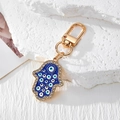 Vintage Hamsa-Hand und Evil Eye Schlüsselanhänger mit blauem Emaille und Strasssteinen - Goldene Multi-Augen-Hamsa Blau