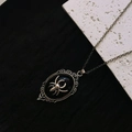 Gothic necklace featuring a silver spider on a black oval pendant with vintage edges - Black Spider Necklace