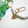Détail du porte-clés sucre d'orge avec nœud rouge sur pierre pour cadeau de Noël - Canne de Bonbon