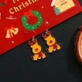 Festive reindeer Christmas earrings with colorful oil drip finish on holiday background - Elk