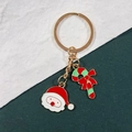 Detail of Christmas keychain with enamel Santa Claus and candy cane charms on gold ring - Santa Claus And Candy Cane