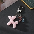 Lichtgevende roze gevlokte ballonhond sleutelhanger met kleurverloop hars hanger - Lichtgevend Roze