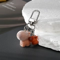 Flocked capybara keychain with resin mini charm on a metallic ring with silver hook - Standing Capybara