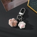 Close-up of pink flocked cat paw and white resin charm on a silver metal keychain - Brown Heart Cat Paw