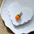 Close-up of a mini orange resin strawberry pendant with green leaves and silver lobster clasp - Orange Strawberry (Silver Clasp)