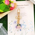 Detail showing pink translucent cherry beads and green enamel leaves on golden keychain - Light Pink Cherry