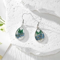Handmade teardrop resin earrings featuring blue real dried flowers and silver hooks - Two Blue Flowers