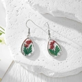 Handmade teardrop resin earrings featuring red dried flowers, green leaves and pearls - Red Flowers Green Leaves