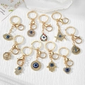 10-piece gold evil eye keychain set with hamsa hand and masonic symbols - Gold Style Pendant Set