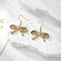 Detailed macro view of bow-shaped resin earrings with real pink dried flowers and gold hooks - Stainless Steel Earring Hook / Pink Flower Green Leaf Small Bow