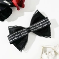 Gothic Lolita black lace bow hair clip with French script ribbon on white background - Black