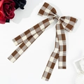 Preppy style brown and cream plaid bow hair clip with long ribbons on white background - Khaki
