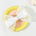 Detail view of large white lace bow hair clip featuring satin fabric and floral embroidery - White (Short)