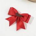Detail of red satin bow hair clip featuring a vintage metal Love letter with rhinestones - Red