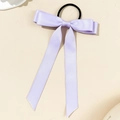 Detail of lavender satin ribbon bow hair tie with premium silky texture and black elastic band - Purple