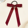 Detail view of burgundy satin bow hair tie with long ribbons and smooth texture - Dark Wine Red