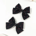 Primer plano de dos elegantes pinzas para el pelo con lazos de lunares negros y rojos - Negro (Corto Individual)