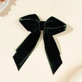 Detailed view of large dark green velvet bow hair clip with elegant long ribbons - Dark Green