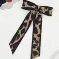 Close-up of leopard print bow hair clip with long ribbons and soft faux fur texture - Leopard Print (Spring Clip-Long Streamer)