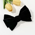 Detail of elegant black velvet double-layer bow hair clip with luxury texture - Black
