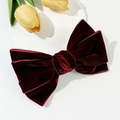 Macro shot of tiered burgundy velvet bow hair clip with rich texture and spring clasp - Burgundy