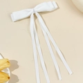 Detail of elegant white double-layered bow hair clip with long satin ribbons for women - White