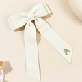 Eleganter cremefarbener Cord-Haarclip mit Schleife und glänzendem Strass-A-Detail - Beige