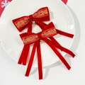 Red velvet Christmas bow hair clips with gold embroidery and bells on white ceramic plate - Red Embroidery Bell Ribbon Style (5#)