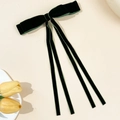 Detail of dark green velvet bow hair clip with long ribbons and smooth texture - Dark Green